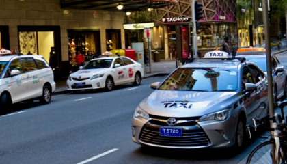 Taxi parked outside Hyde Park, Sydney