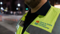 Compliance officer beside road at night