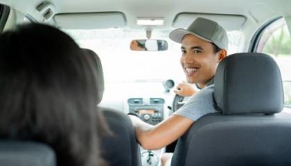 driver smiling at passenger