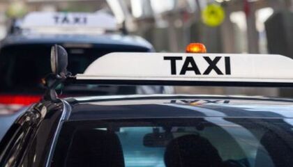Displaying taxi fare hotline stickers 