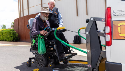Passenger being loaded into a wheelchair accessible vehicle 