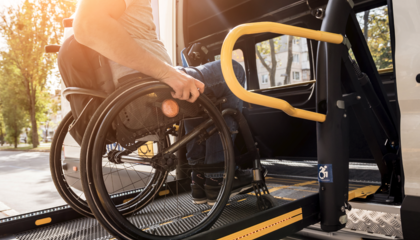 Wheelchair on ramp into wheelchair accessible vehicle