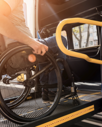 Wheelchair on ramp into wheelchair accessible vehicle